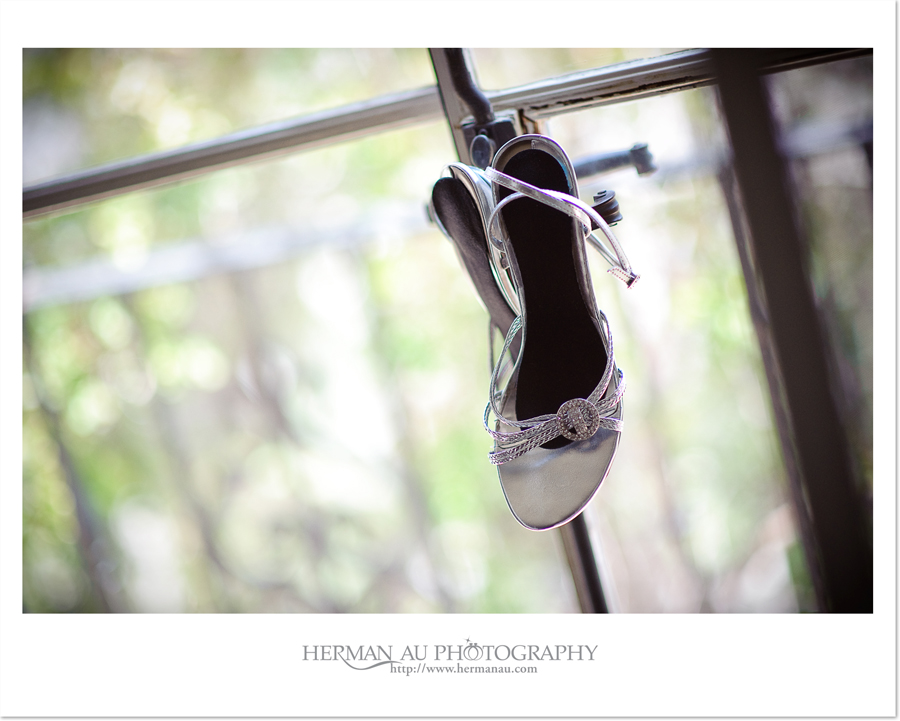 bridal shoes hanging off the window