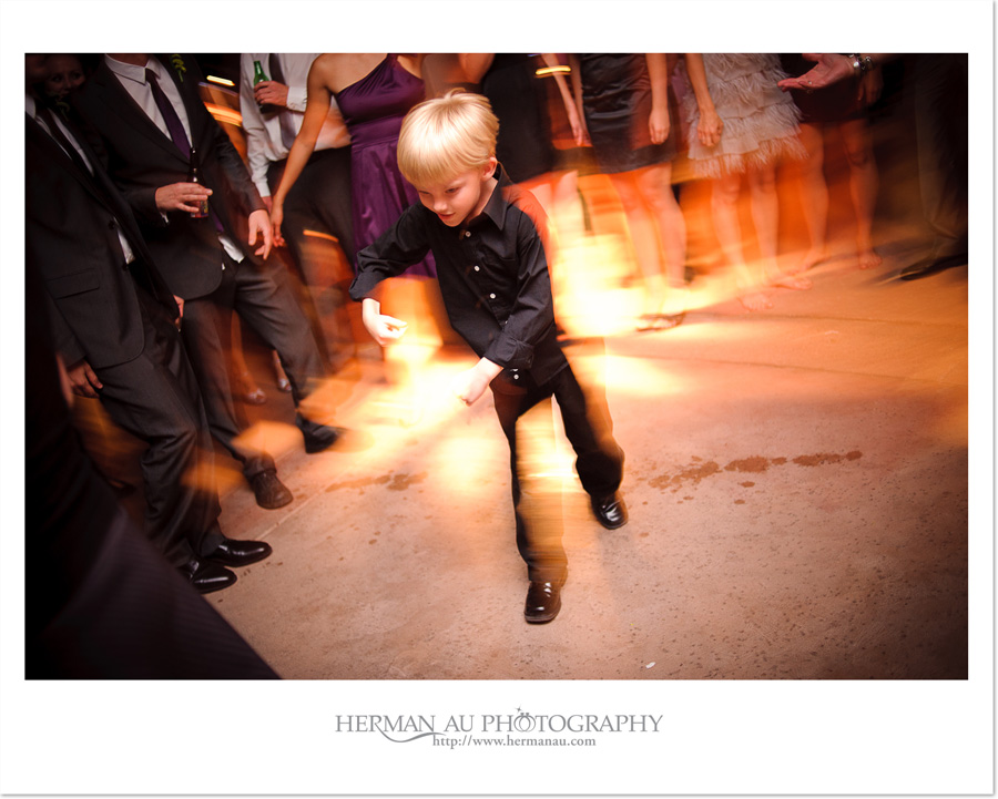 little boy dancing at the wedding reception
