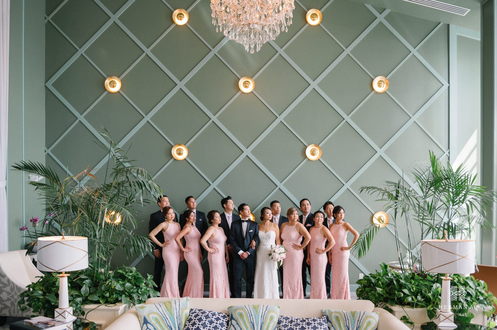 The entire bridal party looking off to the side with their hands on their hips